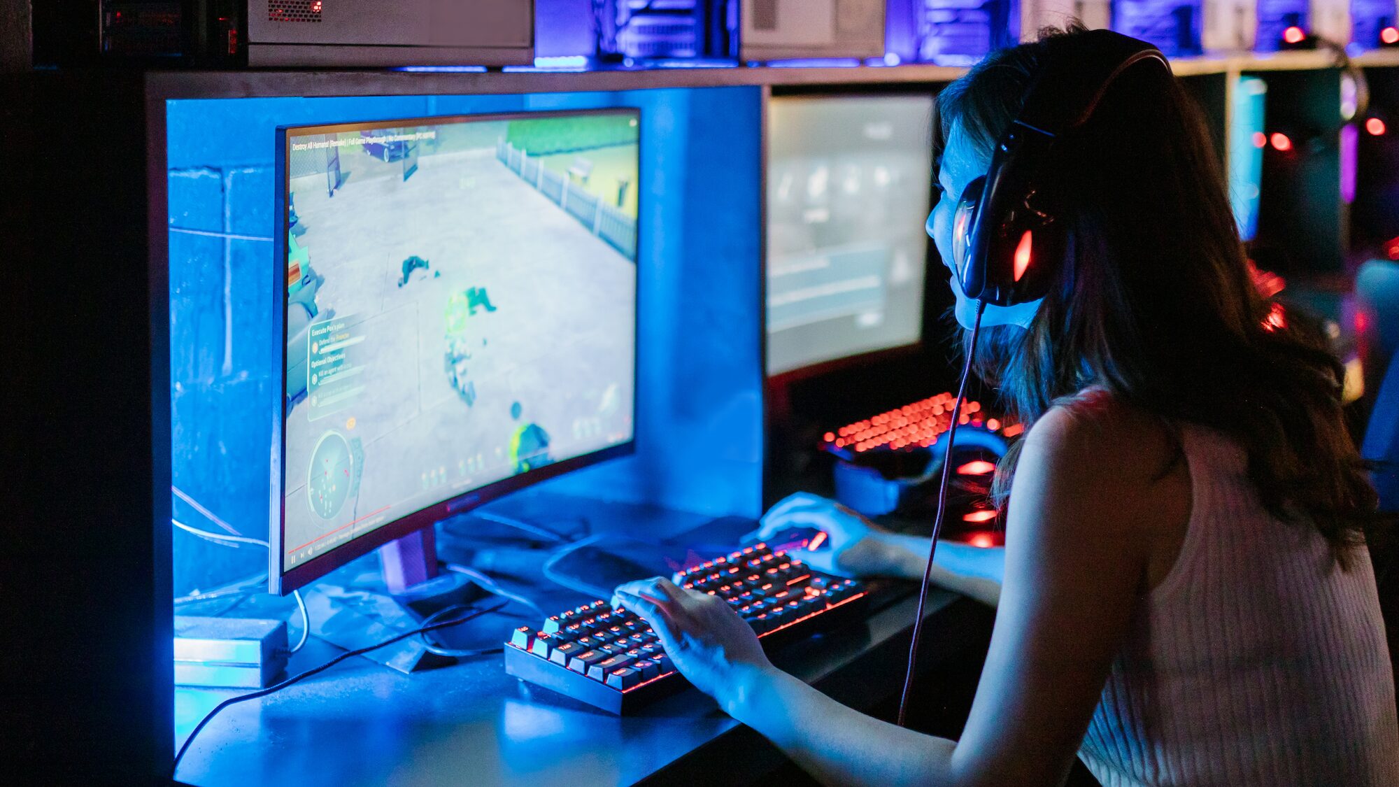 Promotional image of a young woman playing a video game