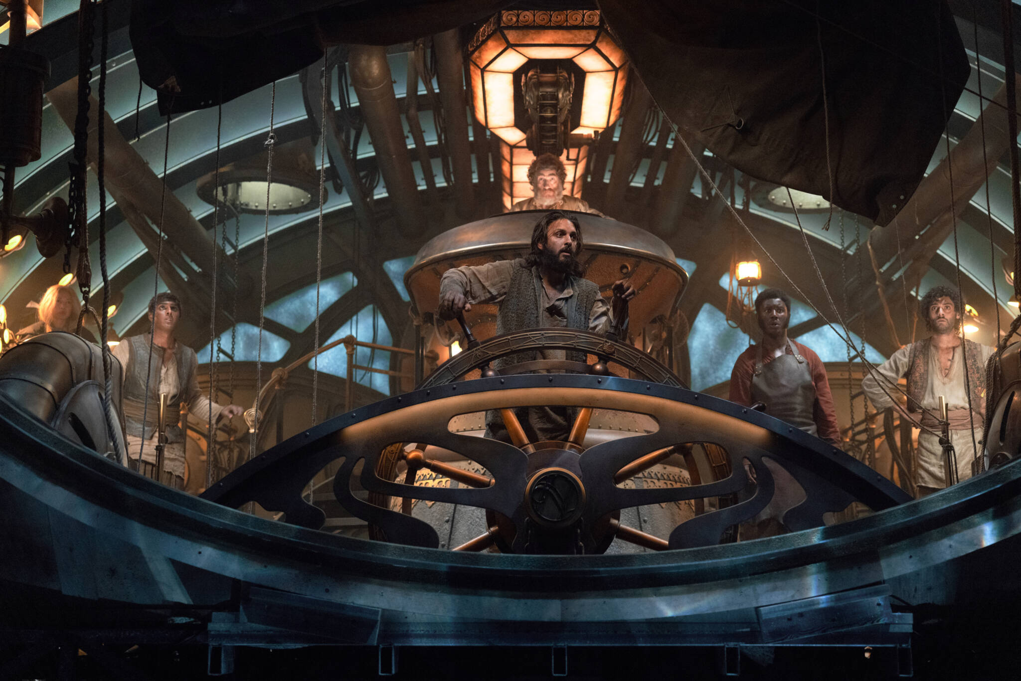 N_01882_R Nautilus/Series 1. (L to R) Ling Cooper Tang as Suyin, Ashan Kumar as Ranbir, Shazad Latif as Captain Nemo, Thierry Fremont as Gustave Benoit, Pacharo Mzembe as Boniface, Arlo Green as Turan in Nautilus. Cr. Vince Valitutti/Disney+ © 2022.