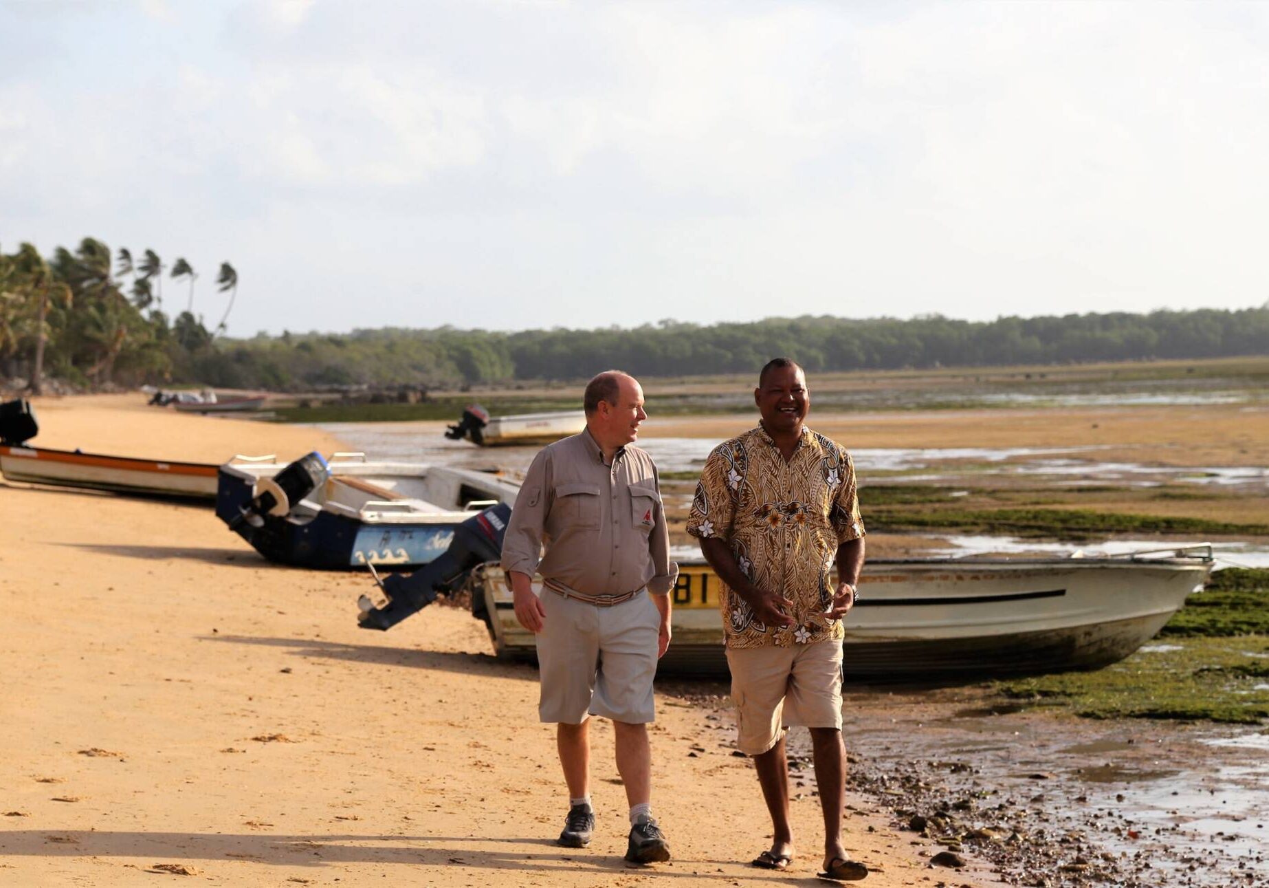 His Serene Highness Prince Albert II of Monaco and Alick Tipoti walk along the beach in film ALICK AND ALBERT