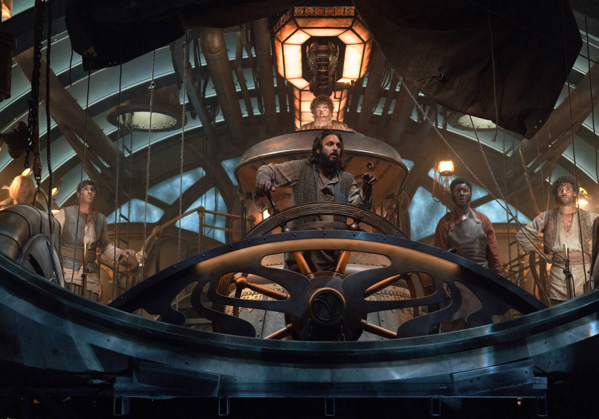 Nautilus/Series 1. (L to R) Ling Cooper Tang as Suyin, Ashan Kumar as Ranbir, Shazad Latif as Captain Nemo, Thierry Fremont as Gustave Benoit, Pacharo Mzembe as Boniface, Arlo Green as Turan in Nautilus.  Cr. Vince Valitutti/Disney+ © 2022.