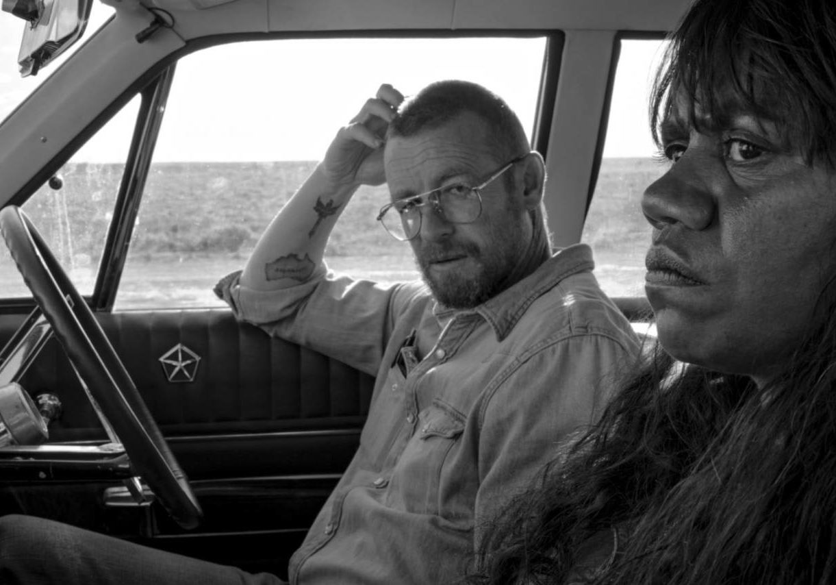 Natasha Wanganeed and Simon Baker sit in a car together from film LIMBO